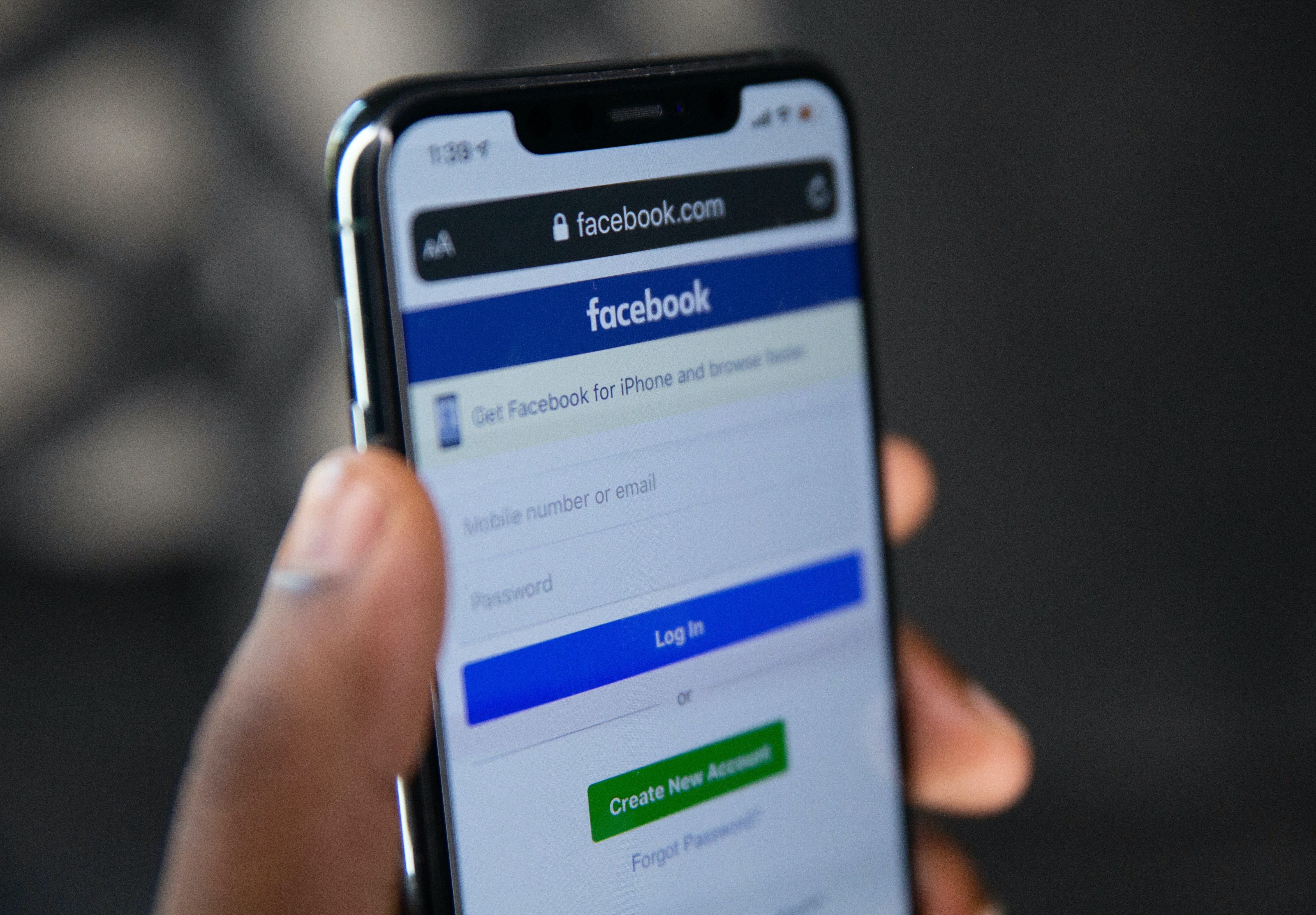 Smartphone with Facebook login page.