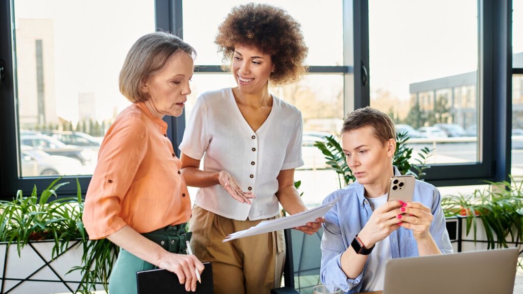 Photo of three people collaborating on key stakeholder identification process.