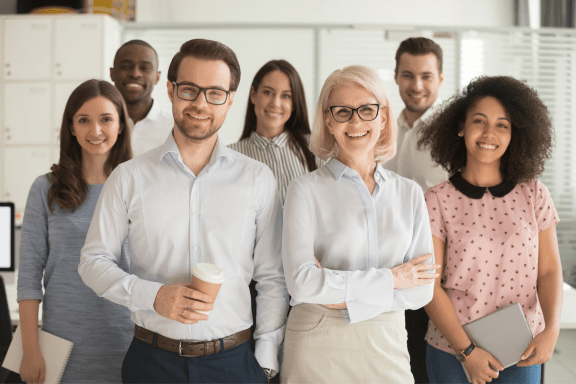 Smiling group of diverse stakeholders.