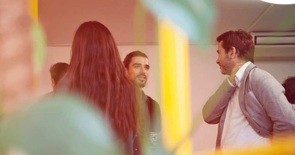 Group of stakeholders communicating face-to-face.